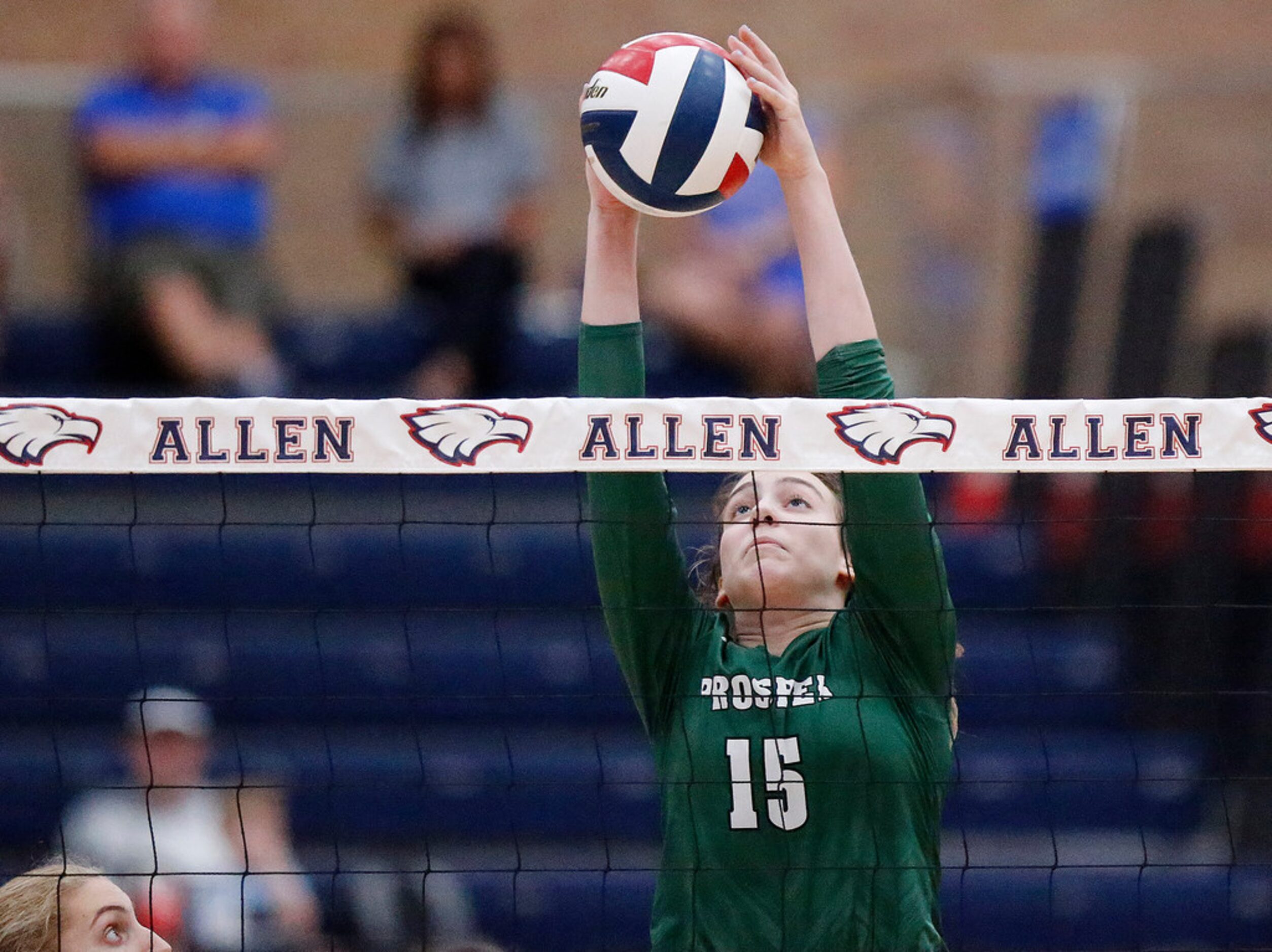 Prosper High School outside hitter Nikki Steinheiser (15) blocks the ball during game one as...