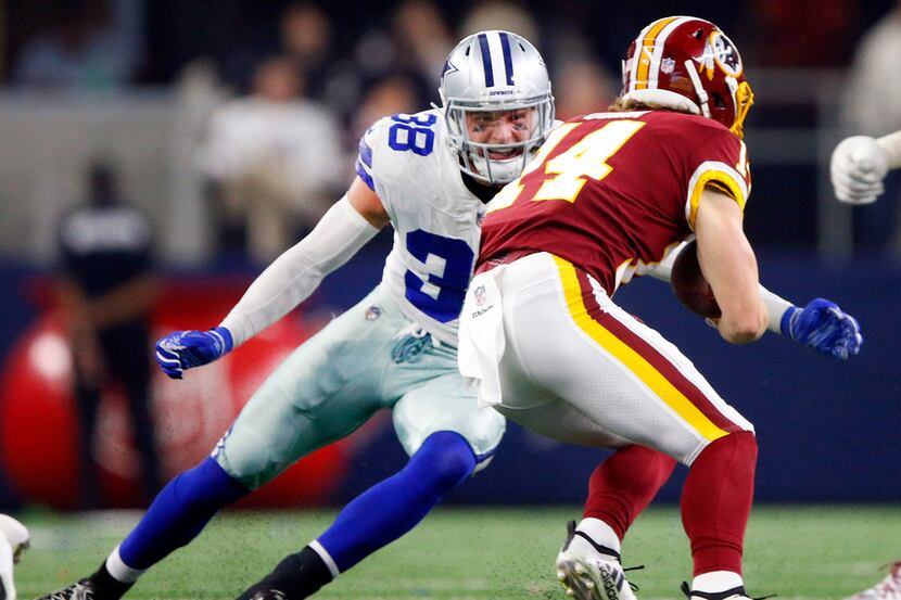 FILE - Dallas Cowboys strong safety Jeff Heath (38) puts the hit on Washington Redskins wide...