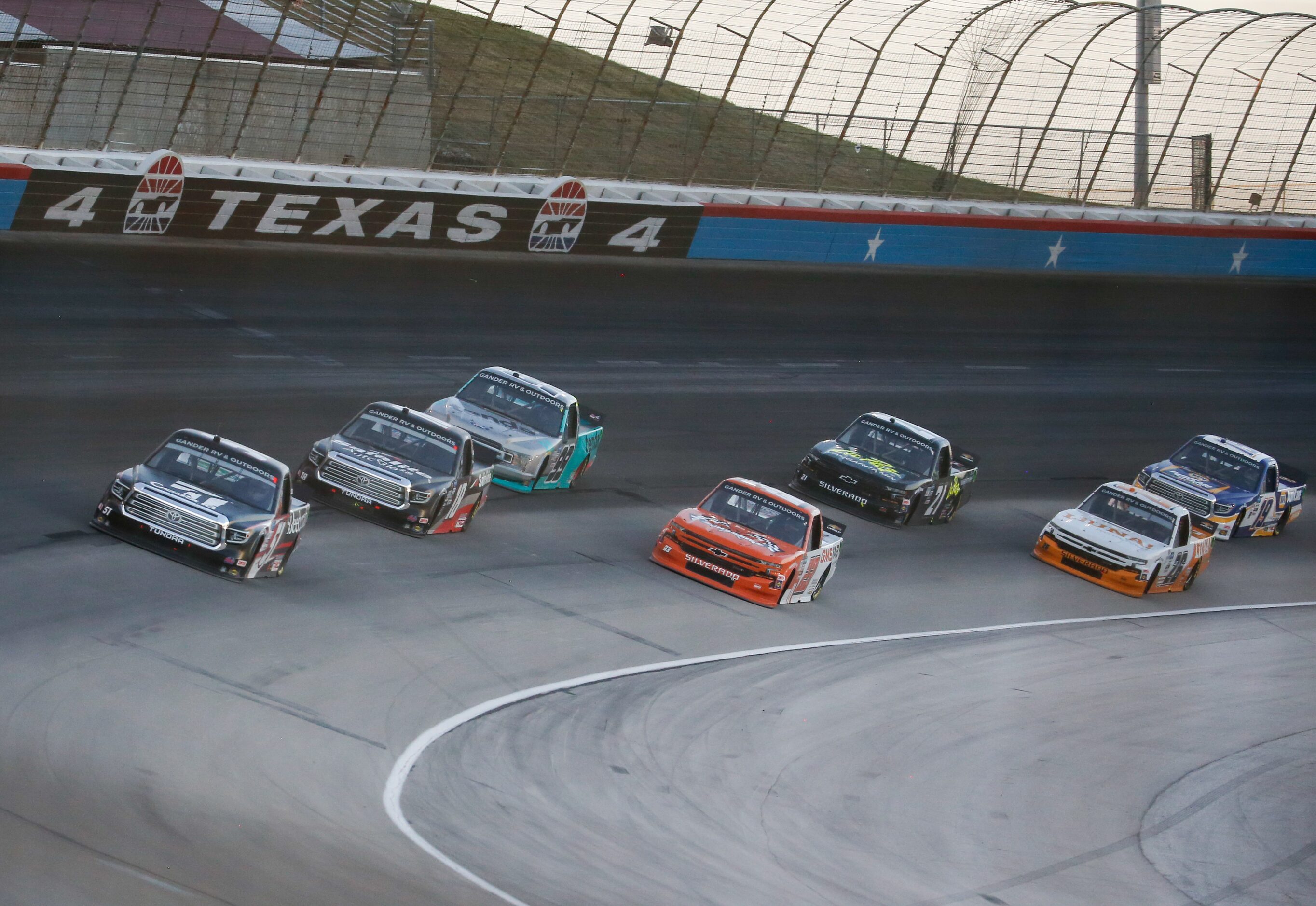 Drivers race during the NASCAR VANKOR 350 truck series race at Texas Motor Speedway on...