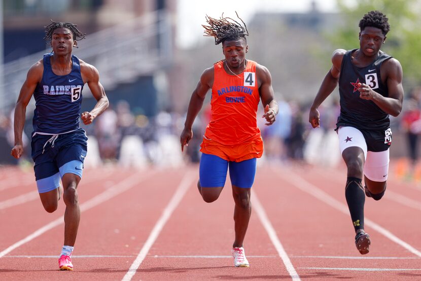 Coppell’s Matthew Maldima (right) wins the 6A boys 100 meter dash ahead of Arlington Bowie’s...