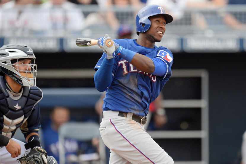 Mar 6, 2014; Peoria, AZ, USA; Texas Rangers second baseman Jurickson Profar (13) hits a...