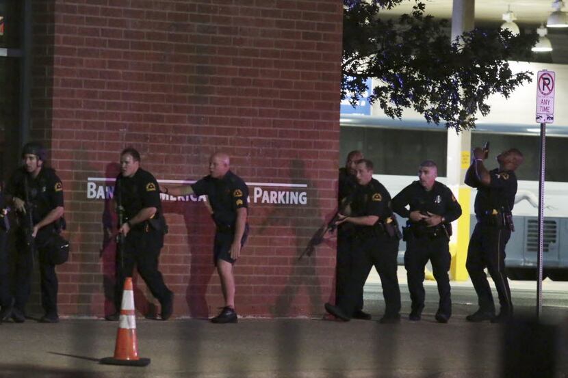 Dallas police respond after shots were fired  during a protest over recent fatal shootings...