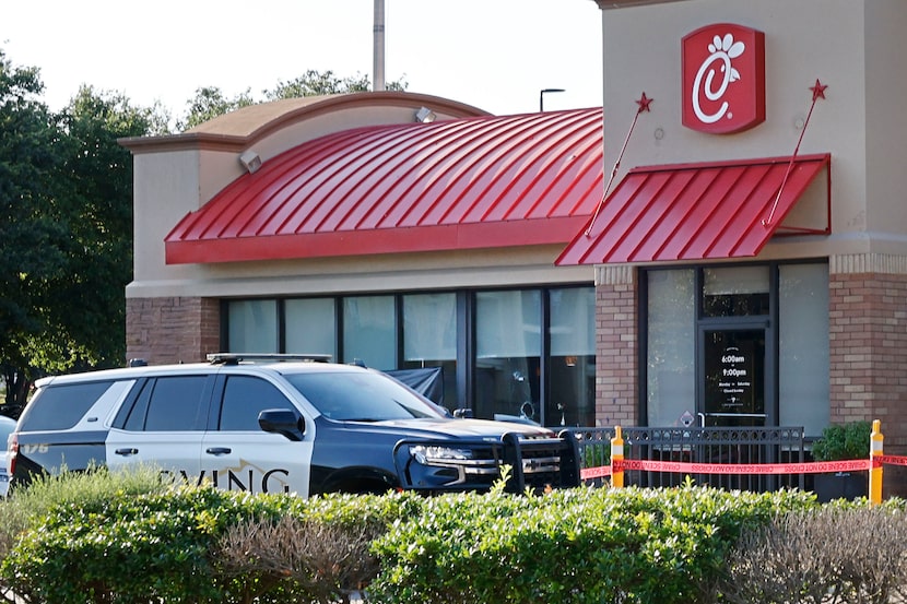 Broken windows are seen at a Chick-fil-A after a shooting, Wednesday, June 26, 2024, in...