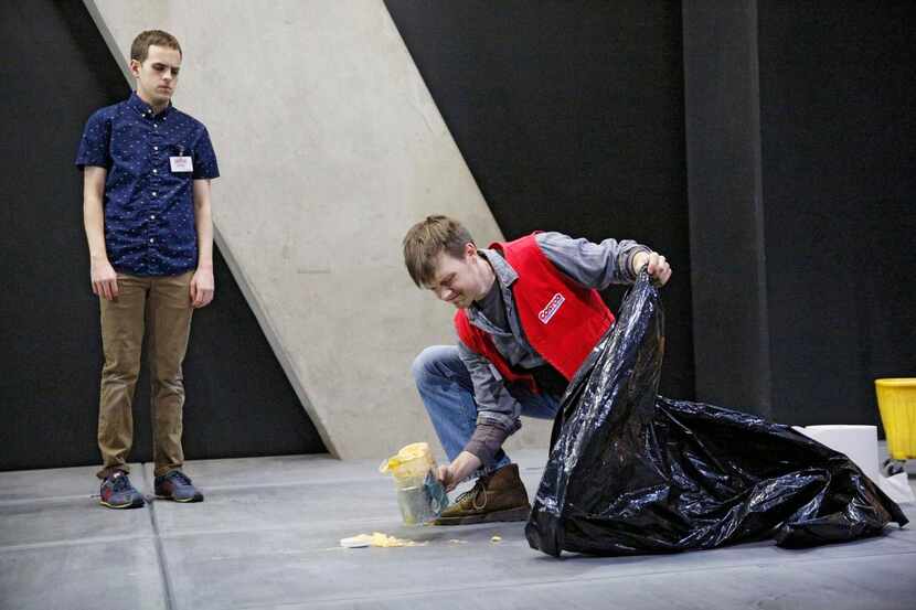 
Jake (Taylor Trensch, left) watches fellow Costco employee Chris (Sam Lilja) tidy up in a...
