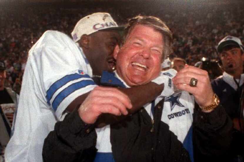 Super Bowl 1993 — Cowboys coach Jimmy  Johnson gets a big hug from wide reciever Michael...