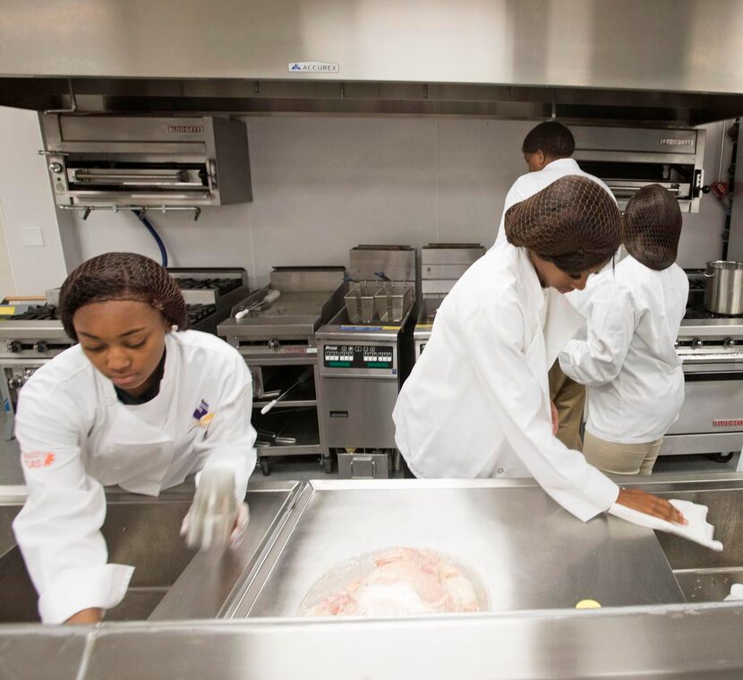 Lincoln High School culinary students Kameran Thomas (left), Shamyria Underwood, Jadaria...