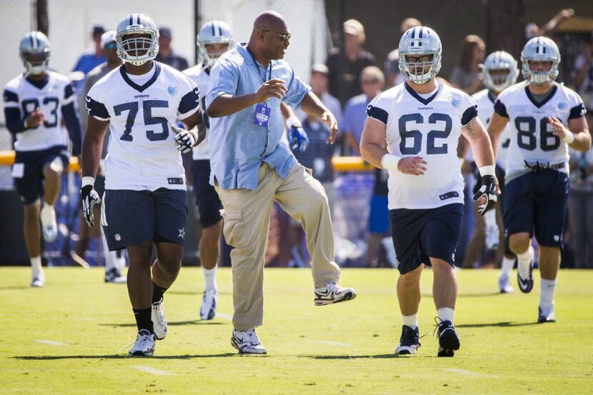 Former Dallas Cowboys linebacker Charles Haley joins tackle Darrion Weems (75) and center...