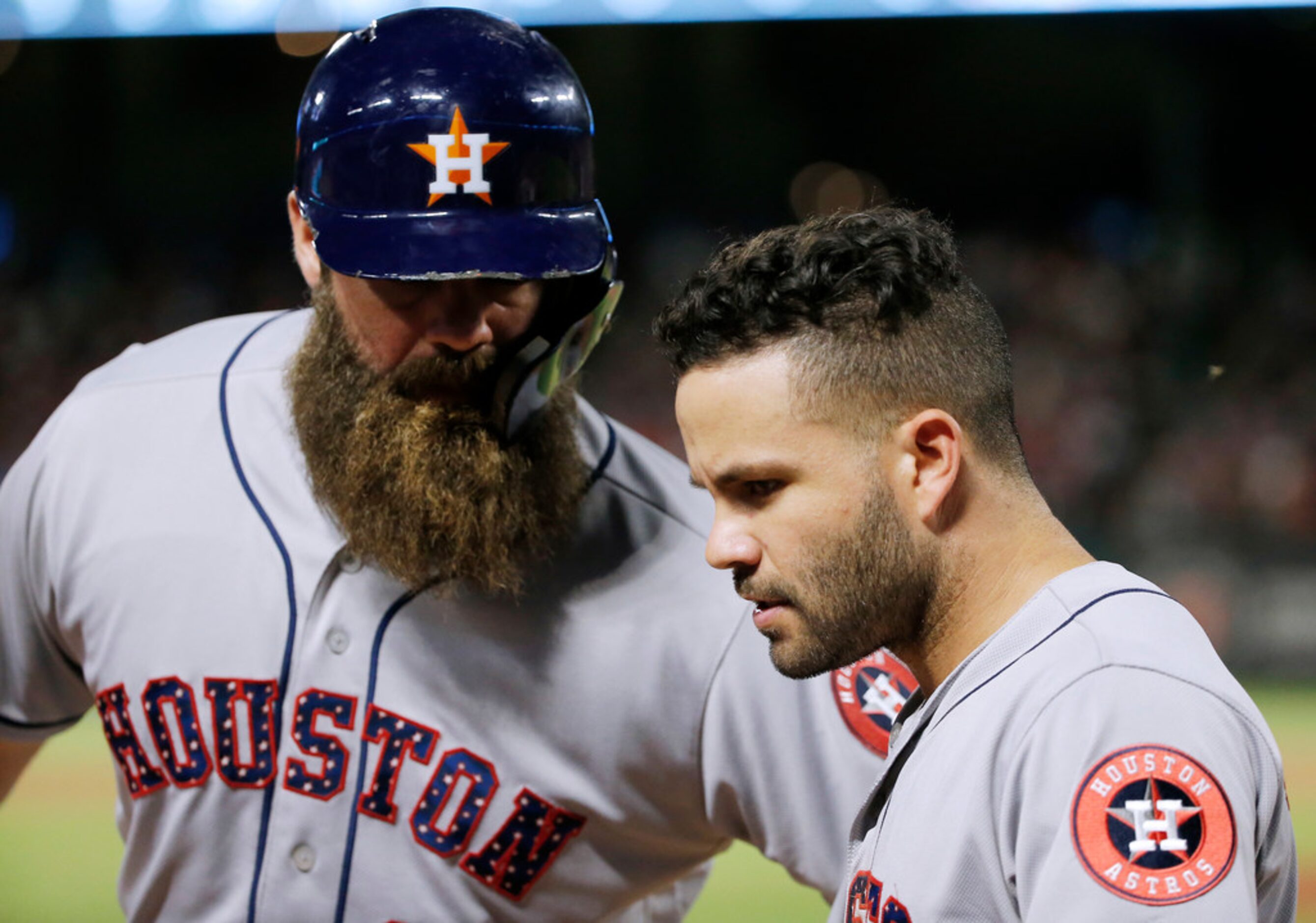 Houston Astros' Evan Gattis, left, and Jose Altuve celebrate Gattis' sacrifice fly that...