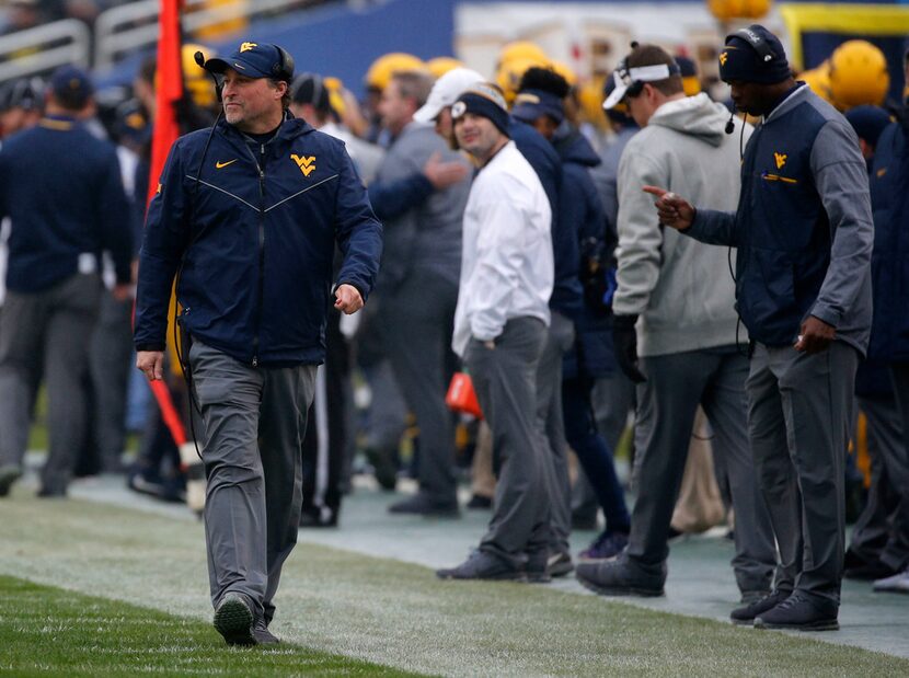 West Virginia Mountaineers head coach Dana Holgorsen watches a play against the Utah Utes...