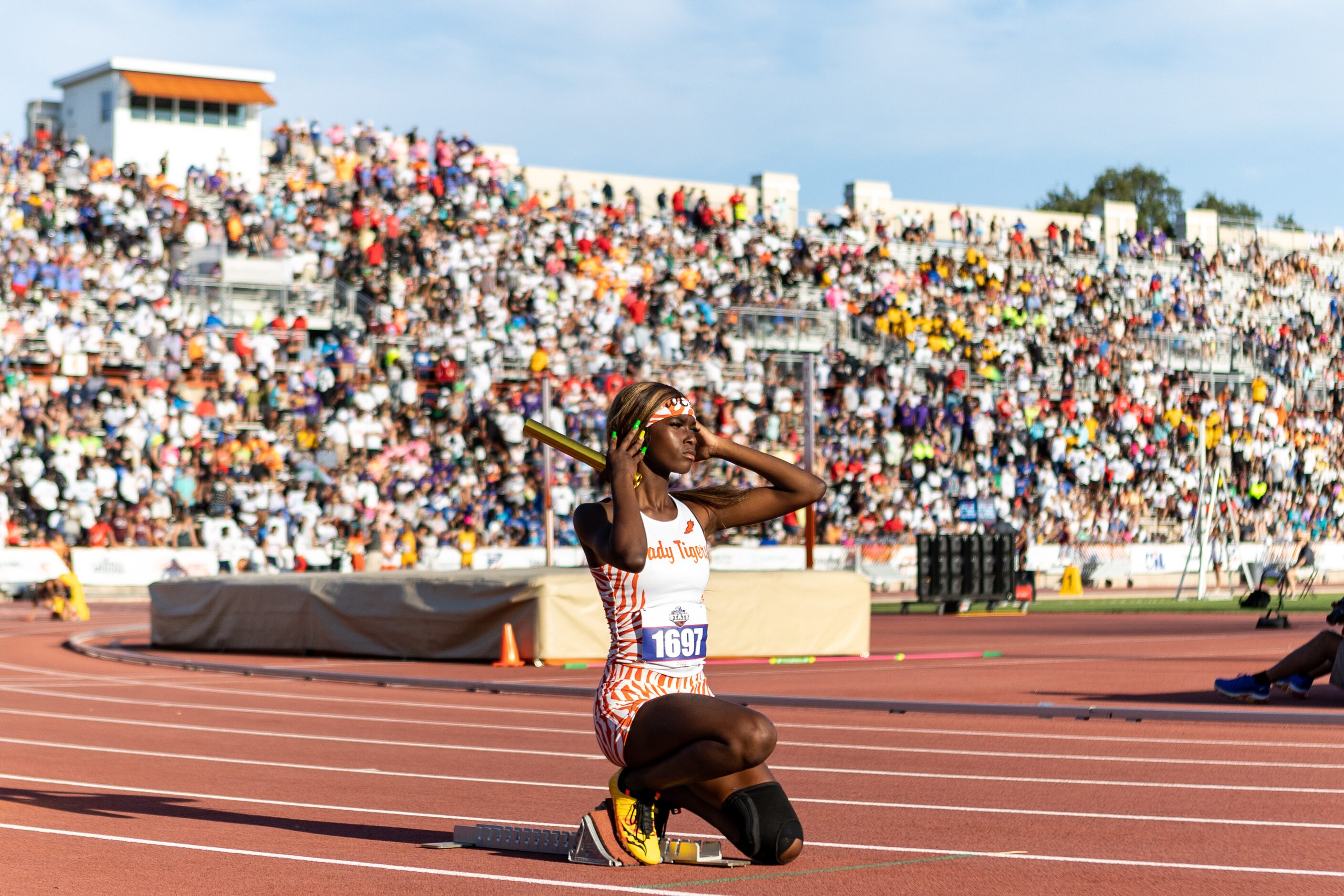 Leeira Williams prepares to lead off the girls’ 4x200 relay for Lancaster at the UIL Track &...