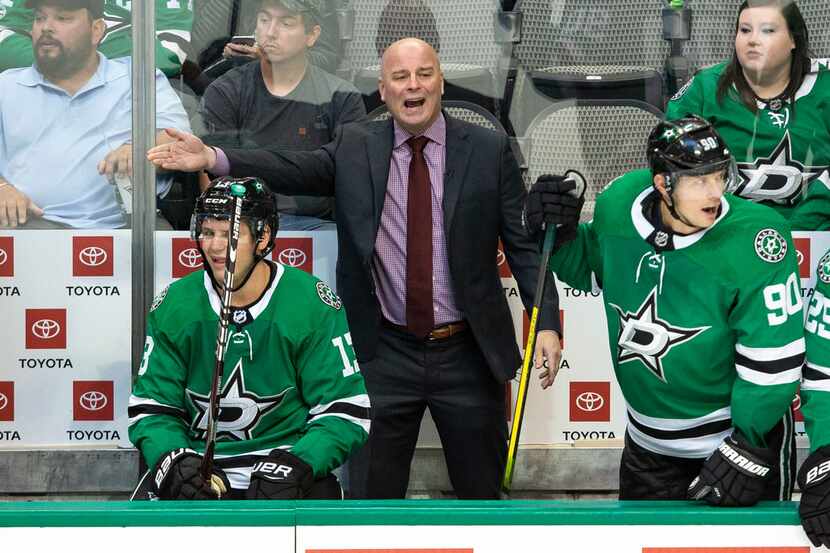 Dallas Stars head coach Jim Montgomery watches his team play during the third period of a...