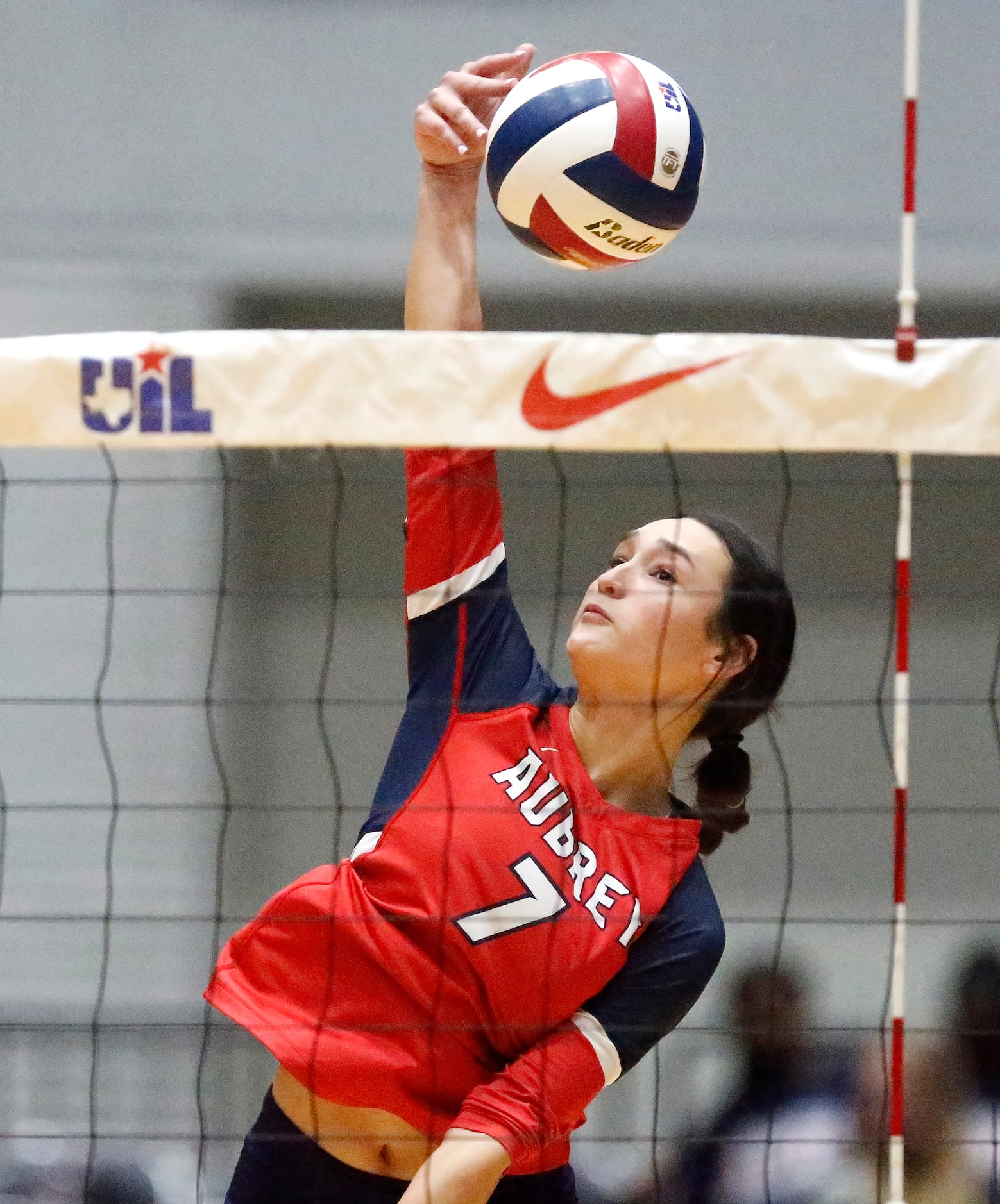 Aubrey High School outside hitter Meagan Szostek (7) tries to hit down the line during game...