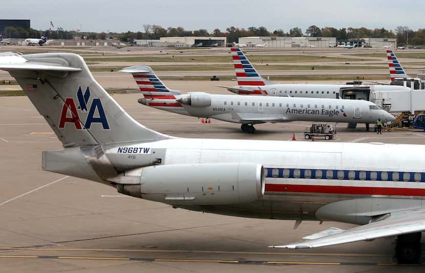 American Airlines and American Eagle planes sit on the tarmac Monday at St. Louis Lambert...