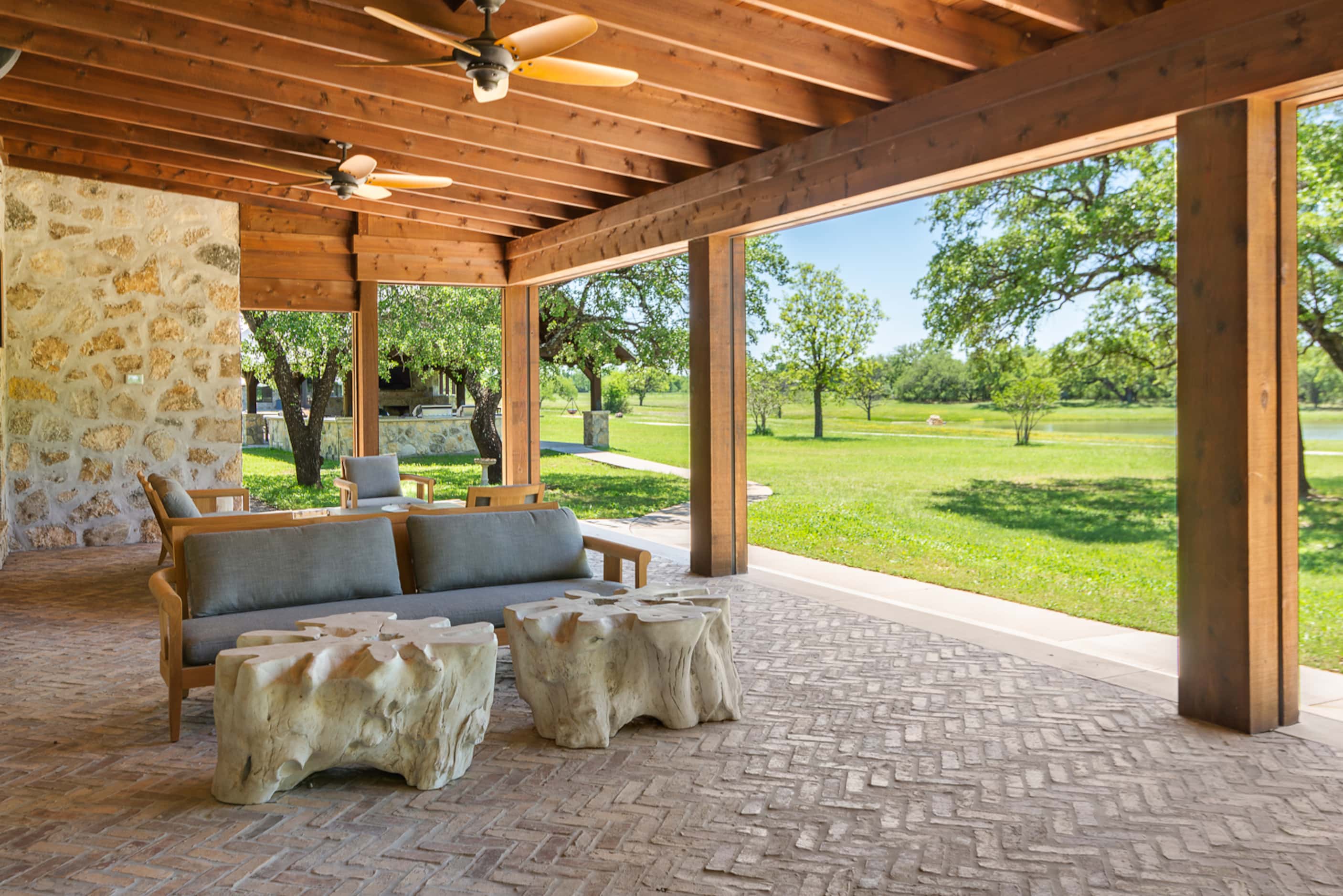 The property features ample outdoor space to take in nature, including an outdoor kitchen...