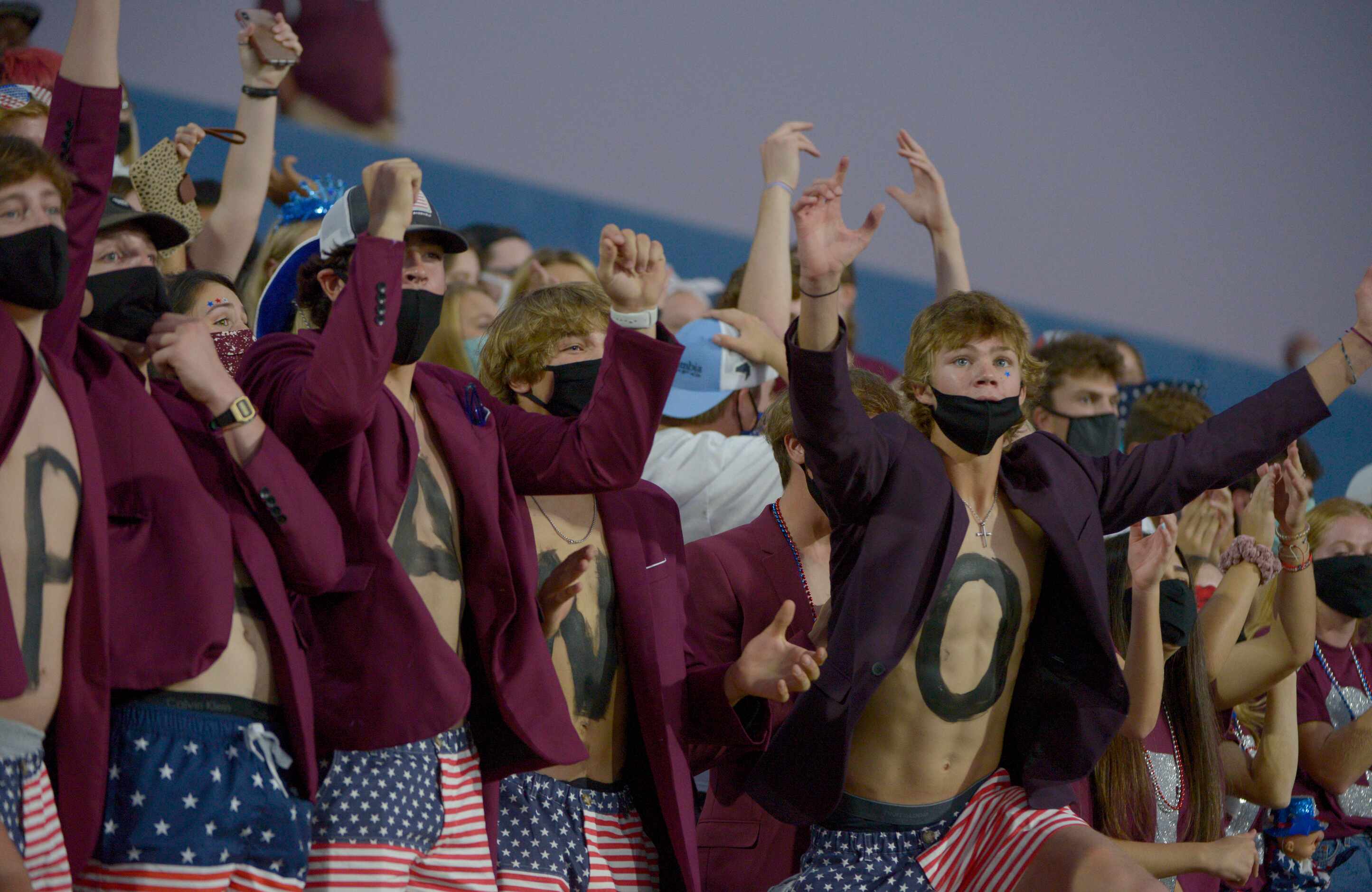 Plano students cheer in the second quarter during a high school football game between Plano...