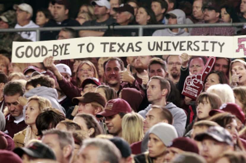 Texas A&M fans express themselves during the second half of their Thanksgiving day game at...