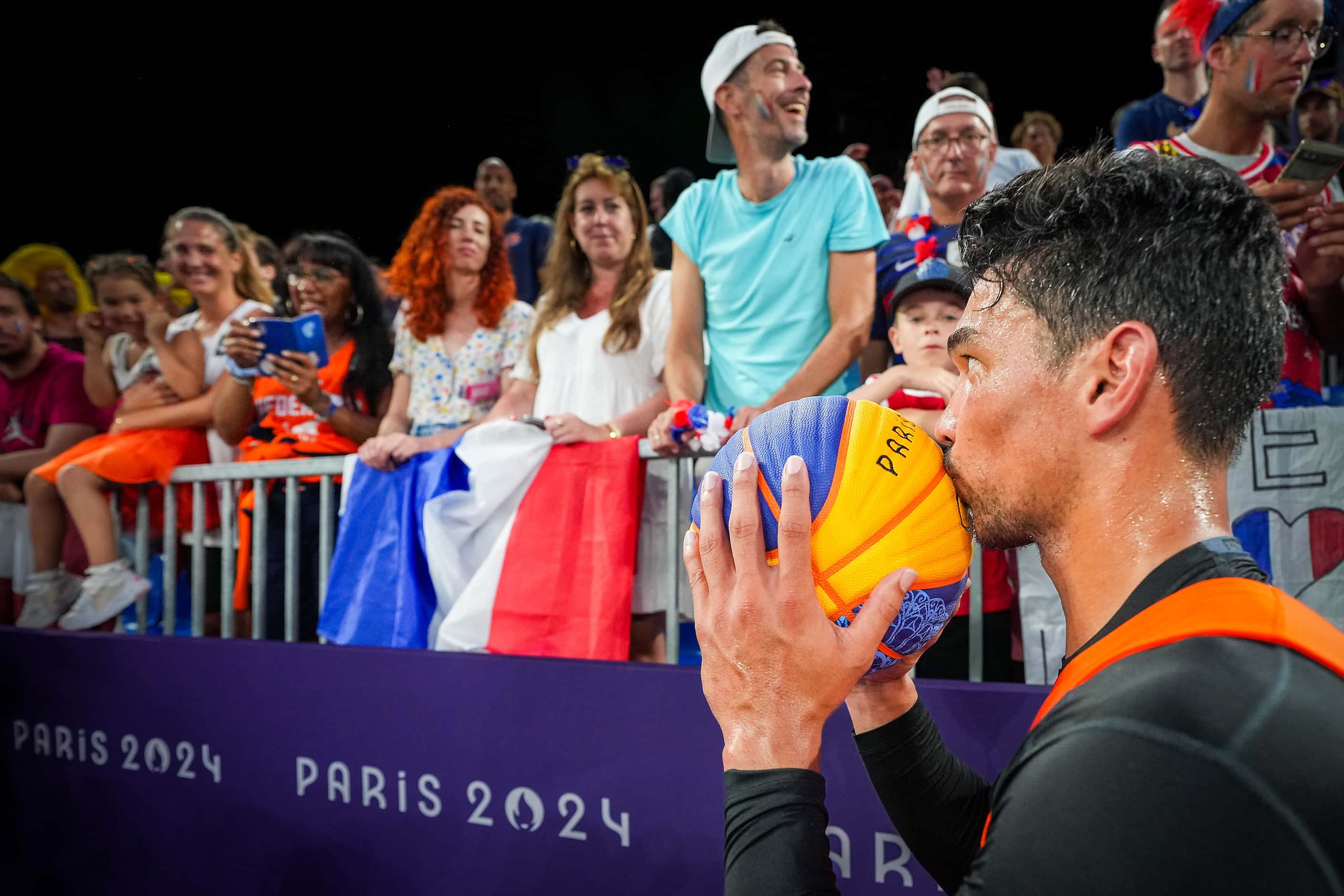 Arvin Slagter of the Netherlands kisses the game ball before handing it to his family after...