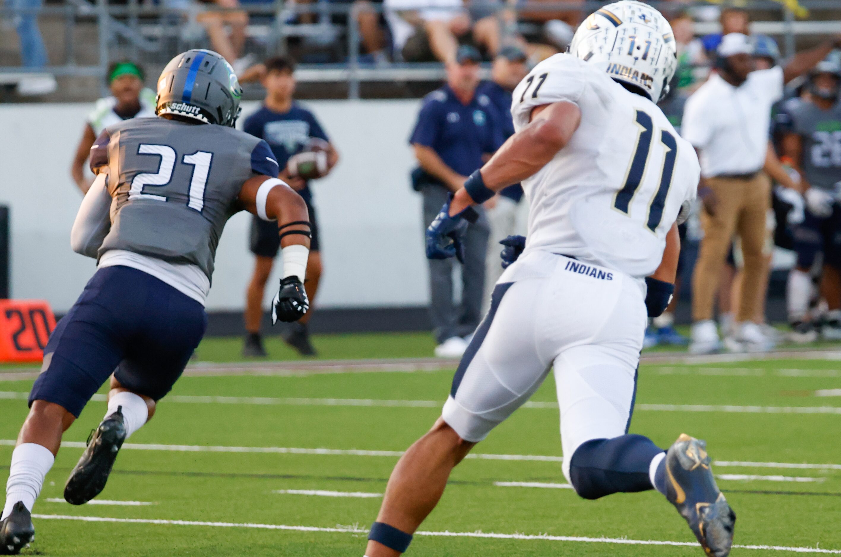 V.R. Eaton High School safety Nicholas Robinson (21) moves down the field after intercepting...