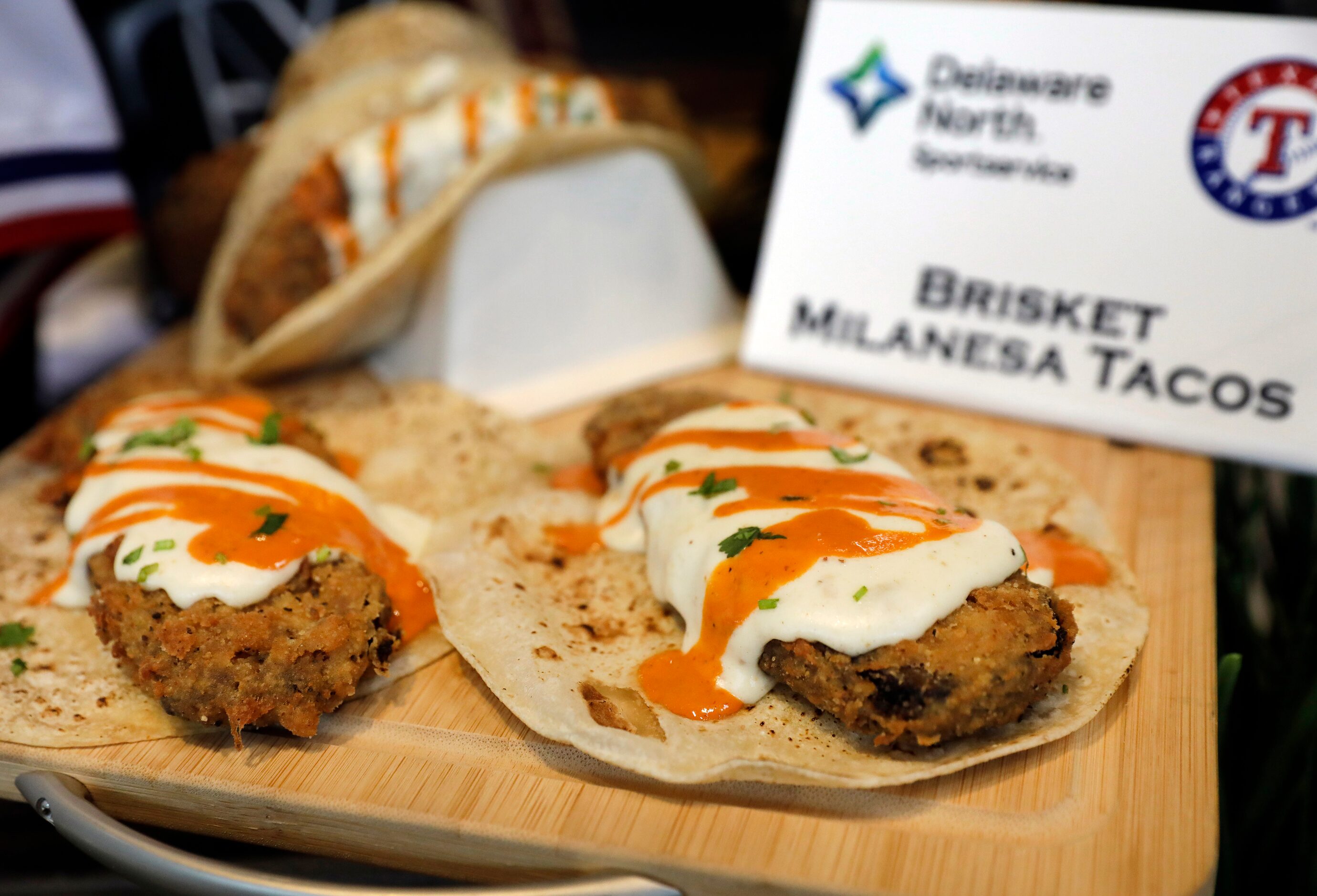 The Texas Rangers unveiled Brisket Milanese Tacos, a menu item for the 2024 season at Globe...