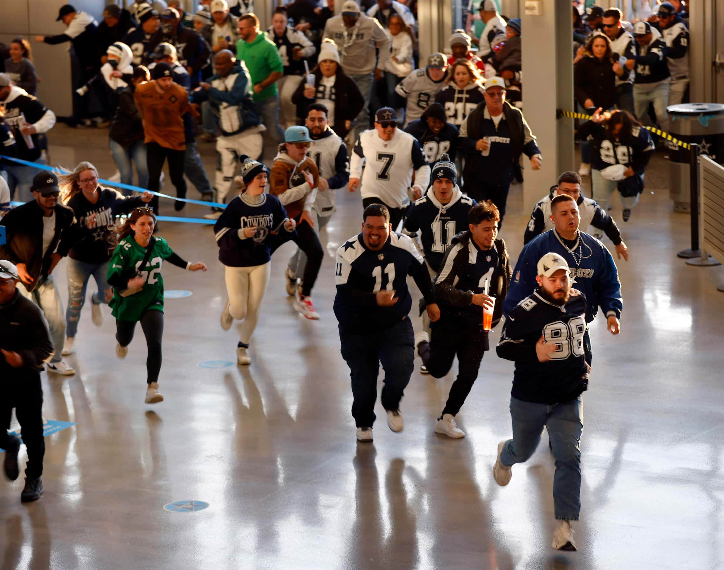 As the doors opened at 5pm, Dallas Cowboys and Philadelphia Eagles fans race to the stairs...