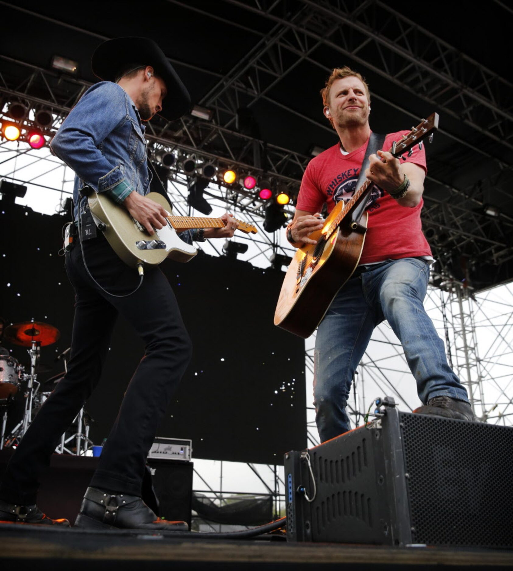 Country singer Dierks Bentley, right , performs at the the Tip-Off Tailgate party before the...