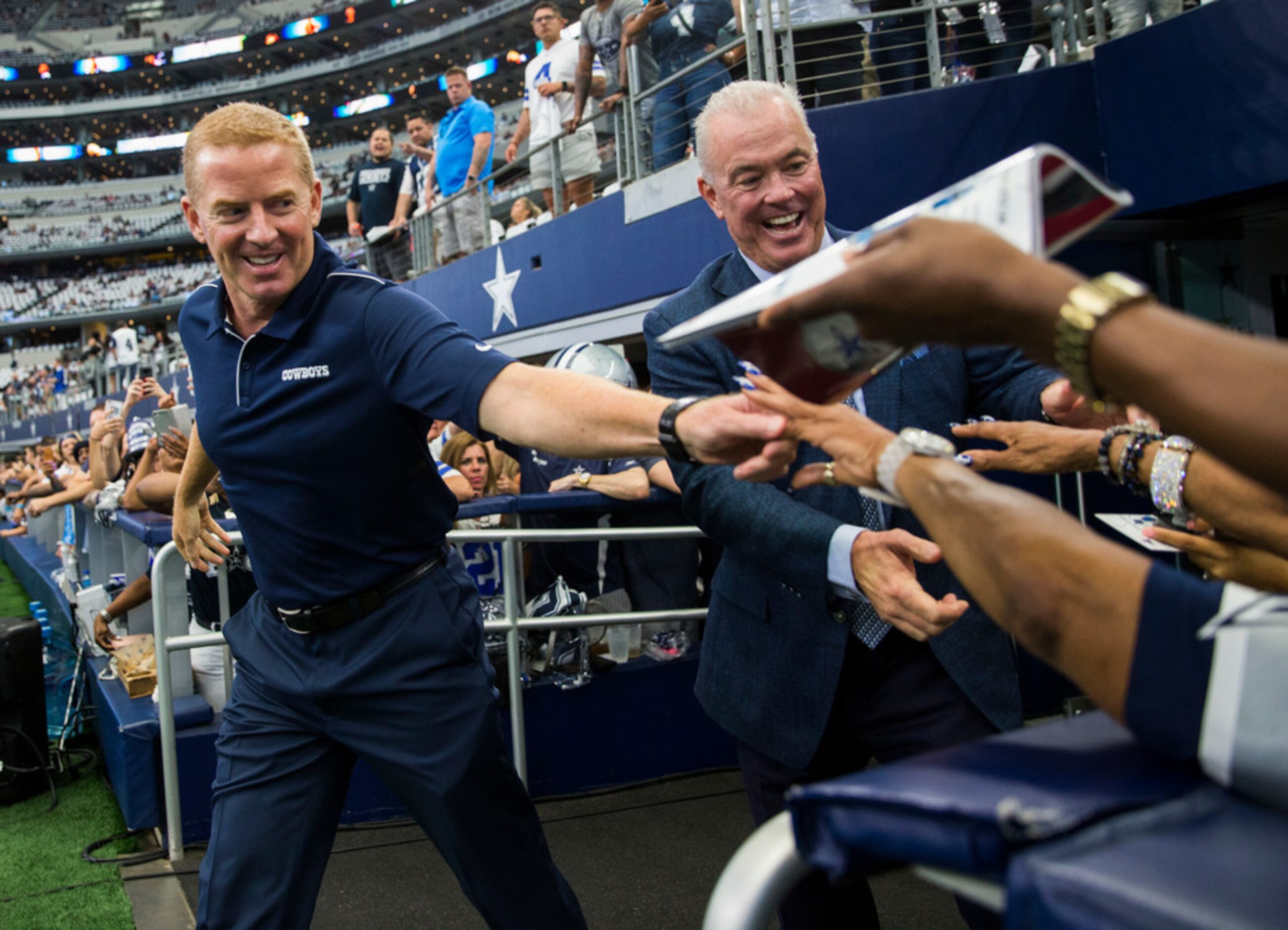 Dallas Cowboys head coach Jason Garrett and and Executive Vice President, CEO, and Director...