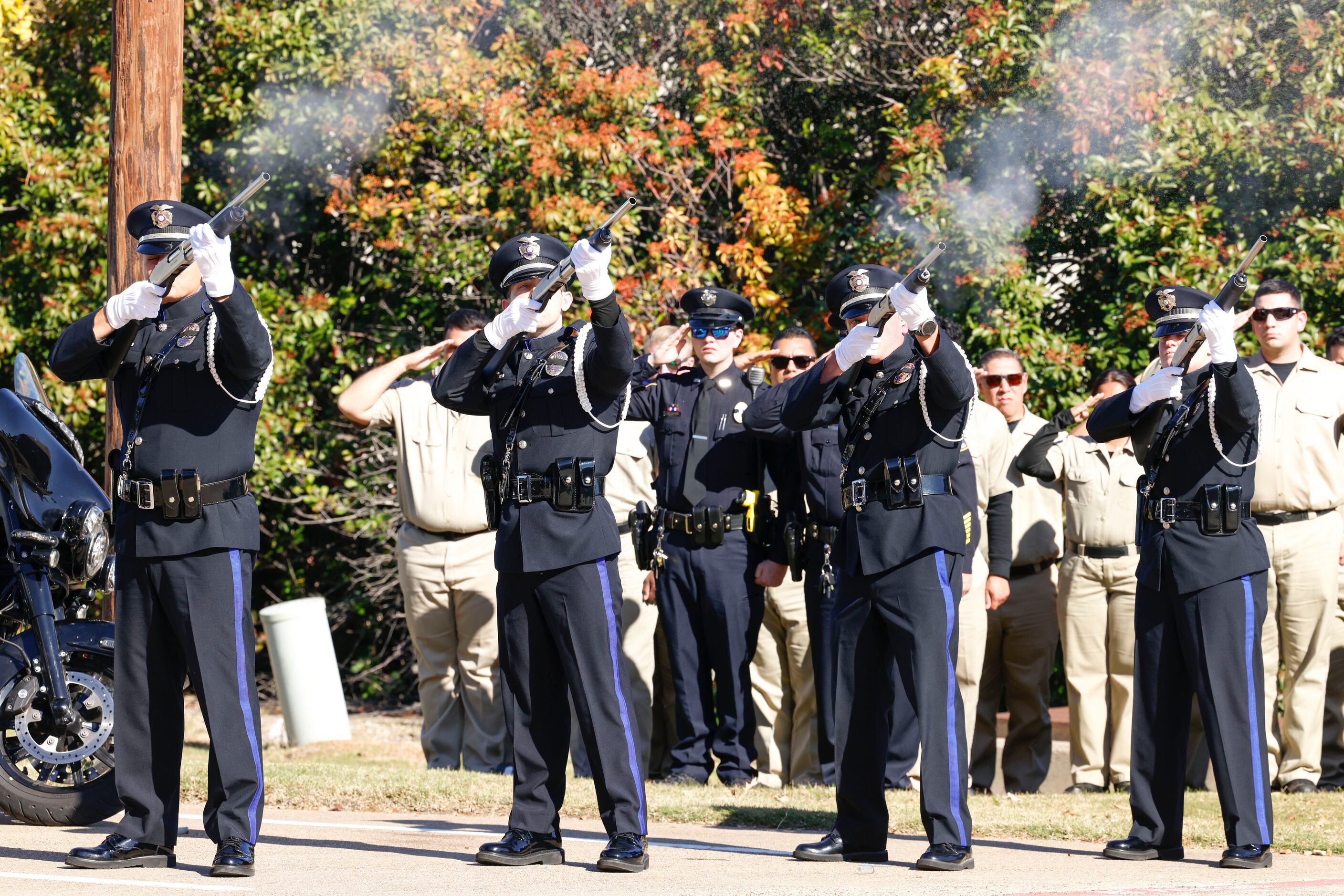 Members of the Plano Police Honor Guard during the funeral of Greenville police officer...