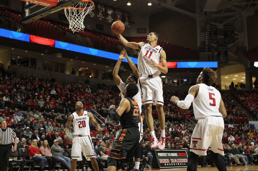Feb 3, 2016; Lubbock, TX, USA; Texas Tech Red Raiders forward Zach Smith (11) goes up for a...