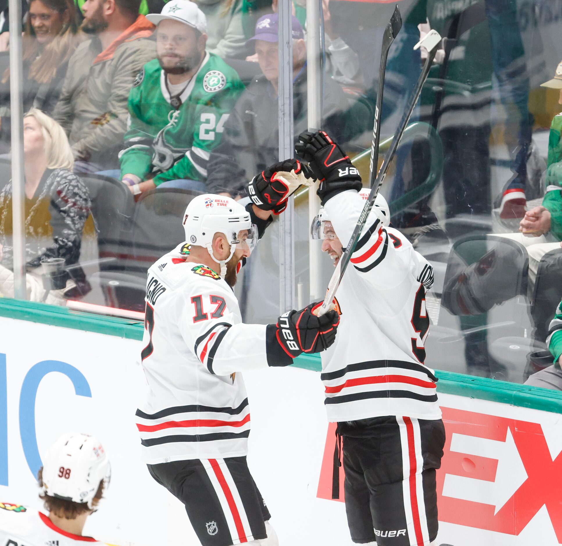 Chicago Blackhawks center Tyler Johnson (right) celebrates his goal with Chicago Blackhawks...