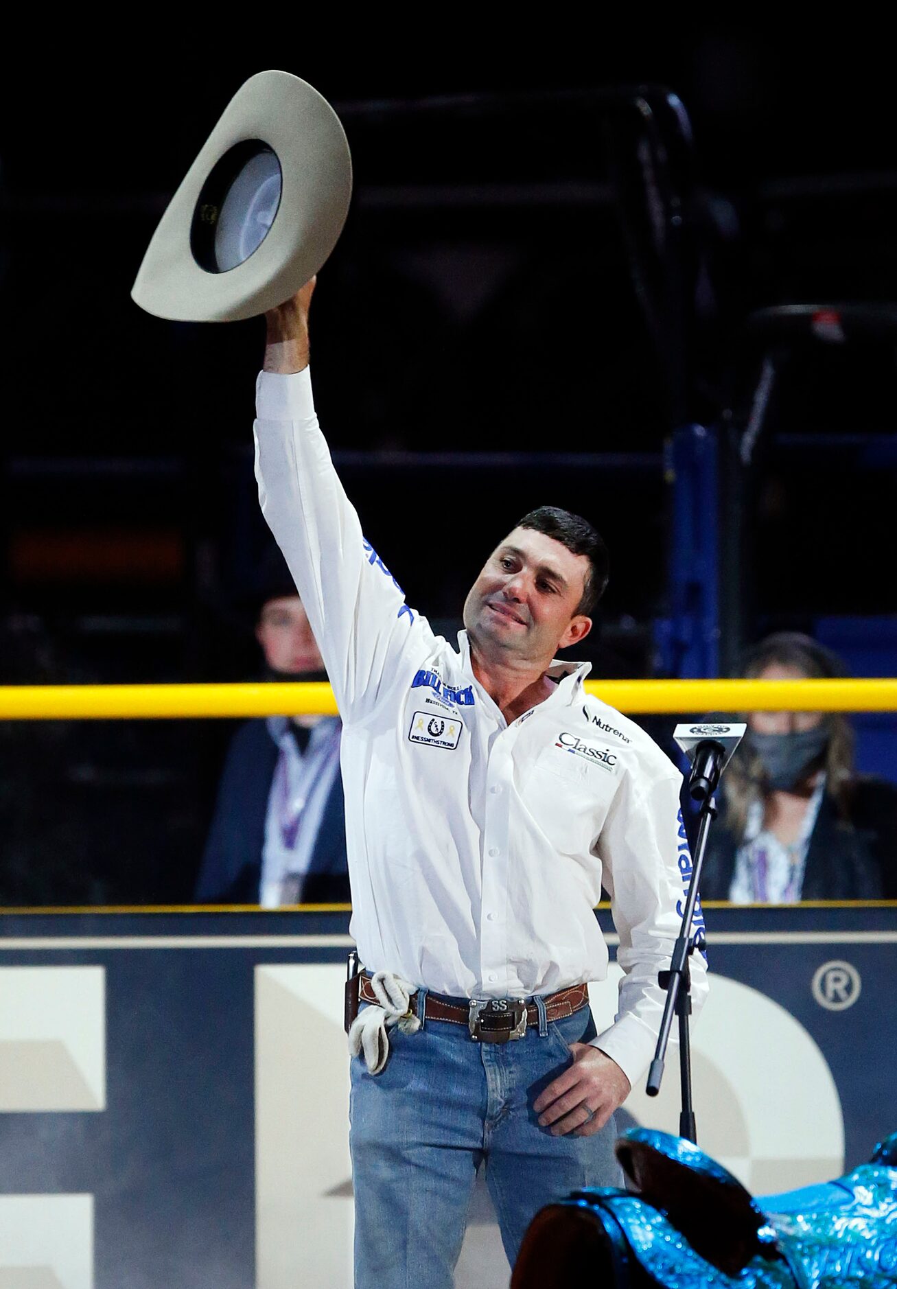 Team Roping Header World Champion Colby Lovell of Madisonville, Texas raises his hat during...