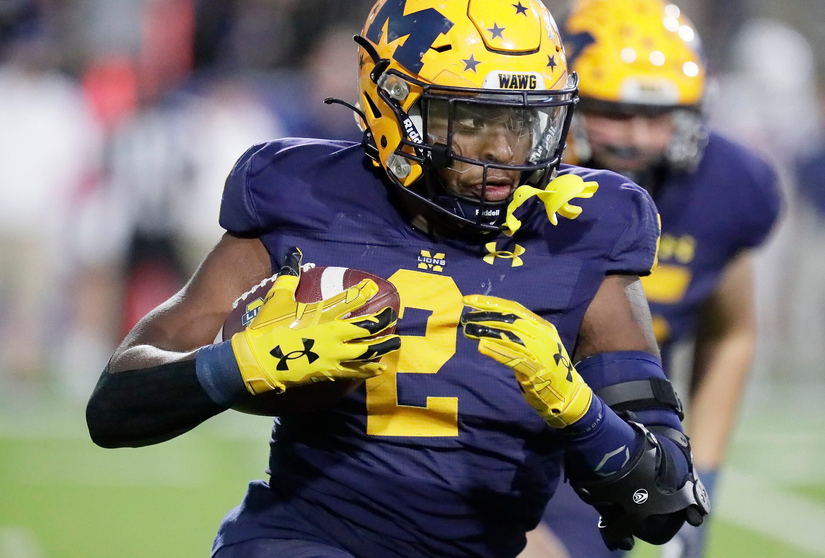 McKinney High School running back Bryan Jackson (2) carries the football during the first...