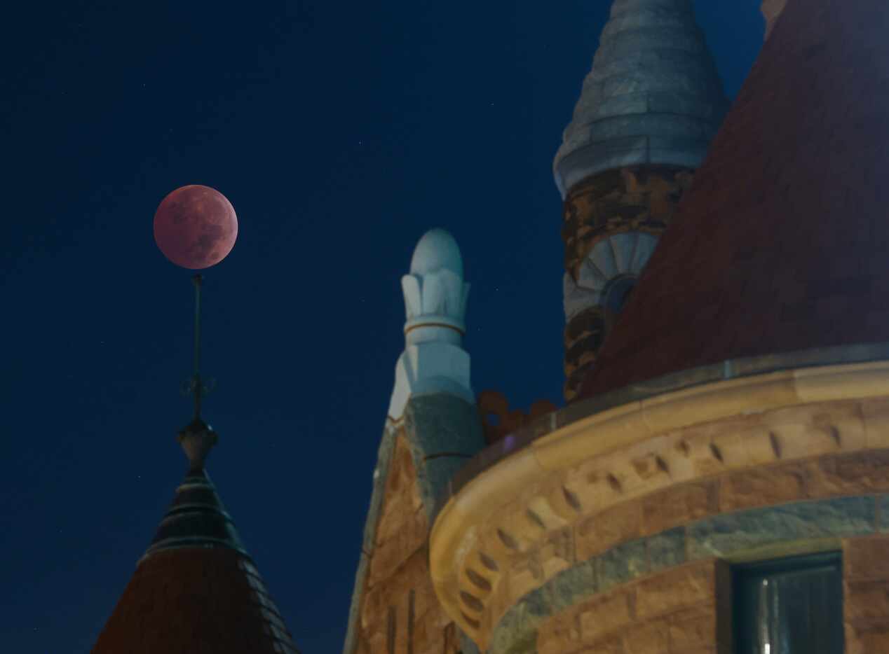 The blood moon lunar eclipse is seen by the Old Red Museum of Dallas County History and...