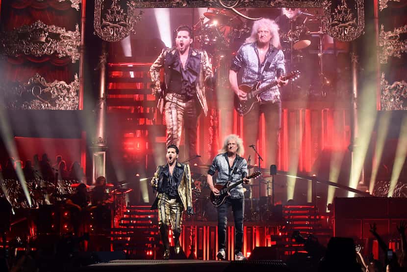 Singer Adam Lambert, left, dances alongside guitarist Brian May during the Queen + Adam...