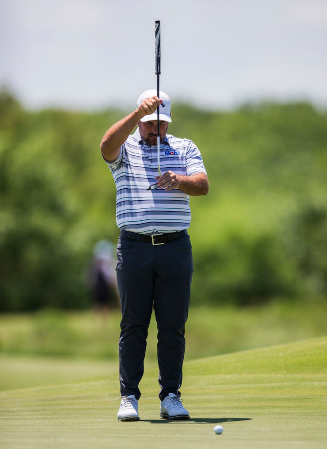 Roberto Diaz lines up a shot on the third green during round 4 of the AT&T Byron Nelson golf...