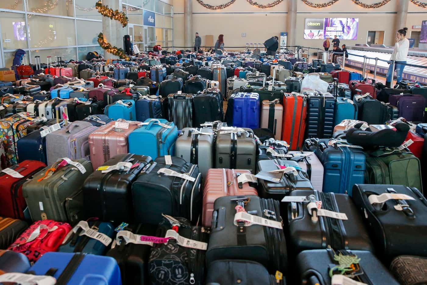 Hundreds of unclaimed bags sit outside the Southwest Airlines baggage service office at Love...