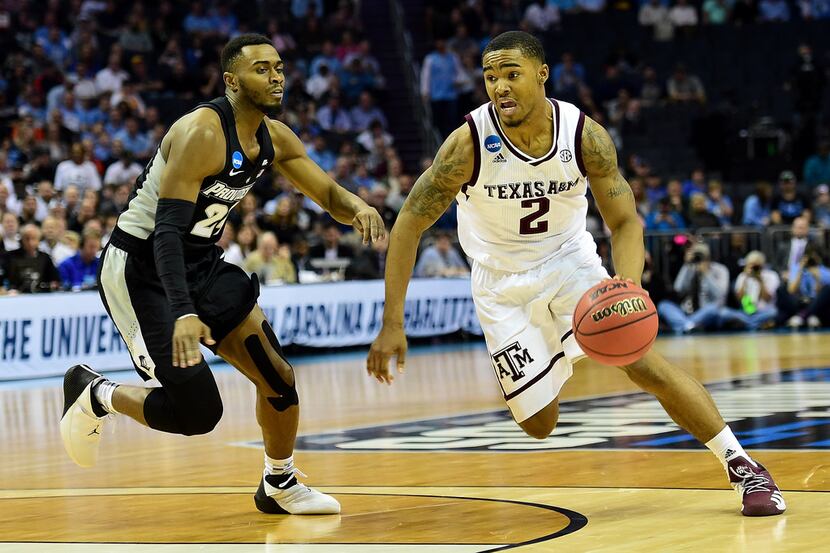 CHARLOTTE, NC - MARCH 16:  T.J. Starks #2 of the Texas A&M Aggies drives to the basket...