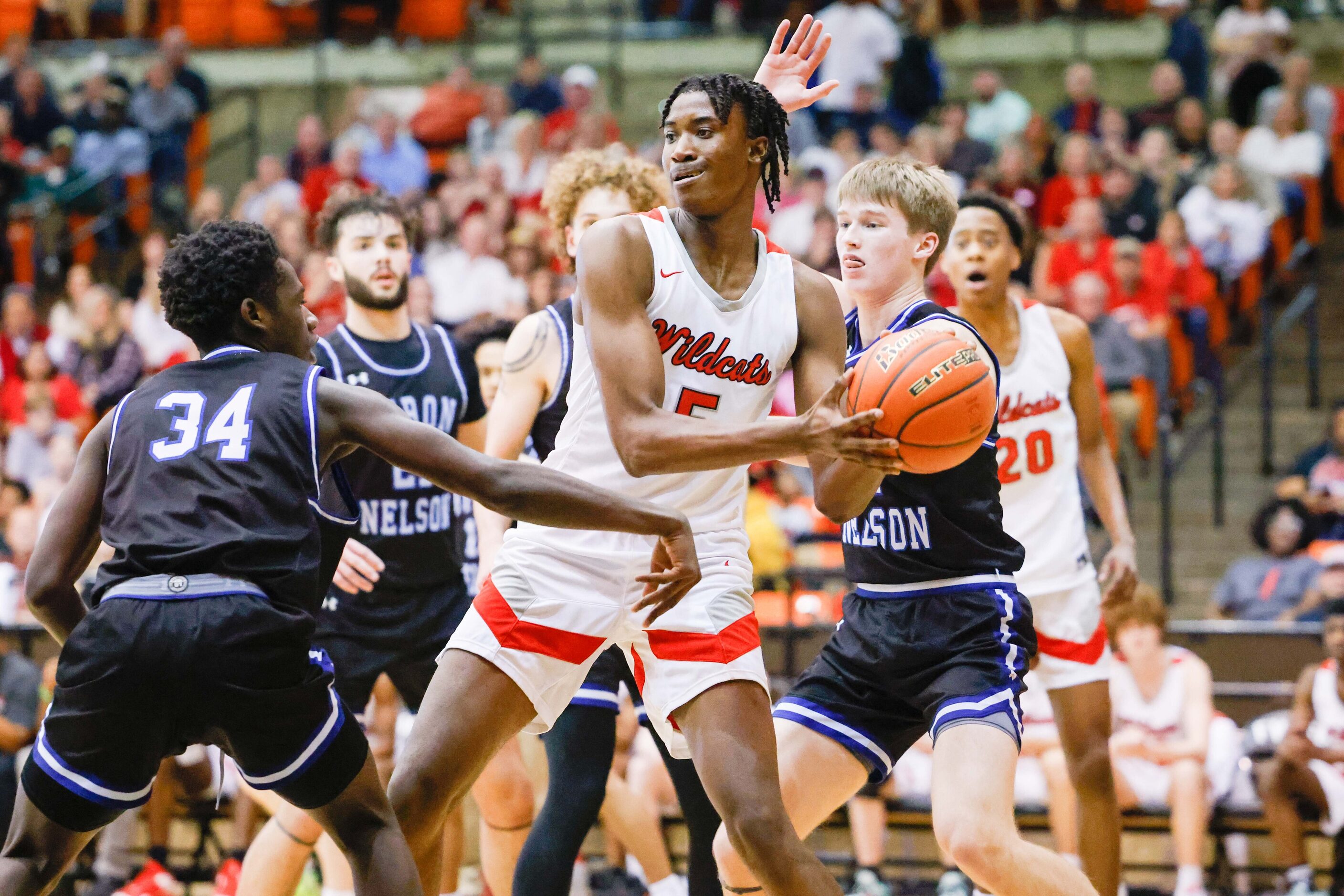 Lake Highlands High School' Chidi Umeh (5) protects the ball against Byron Nelson High...