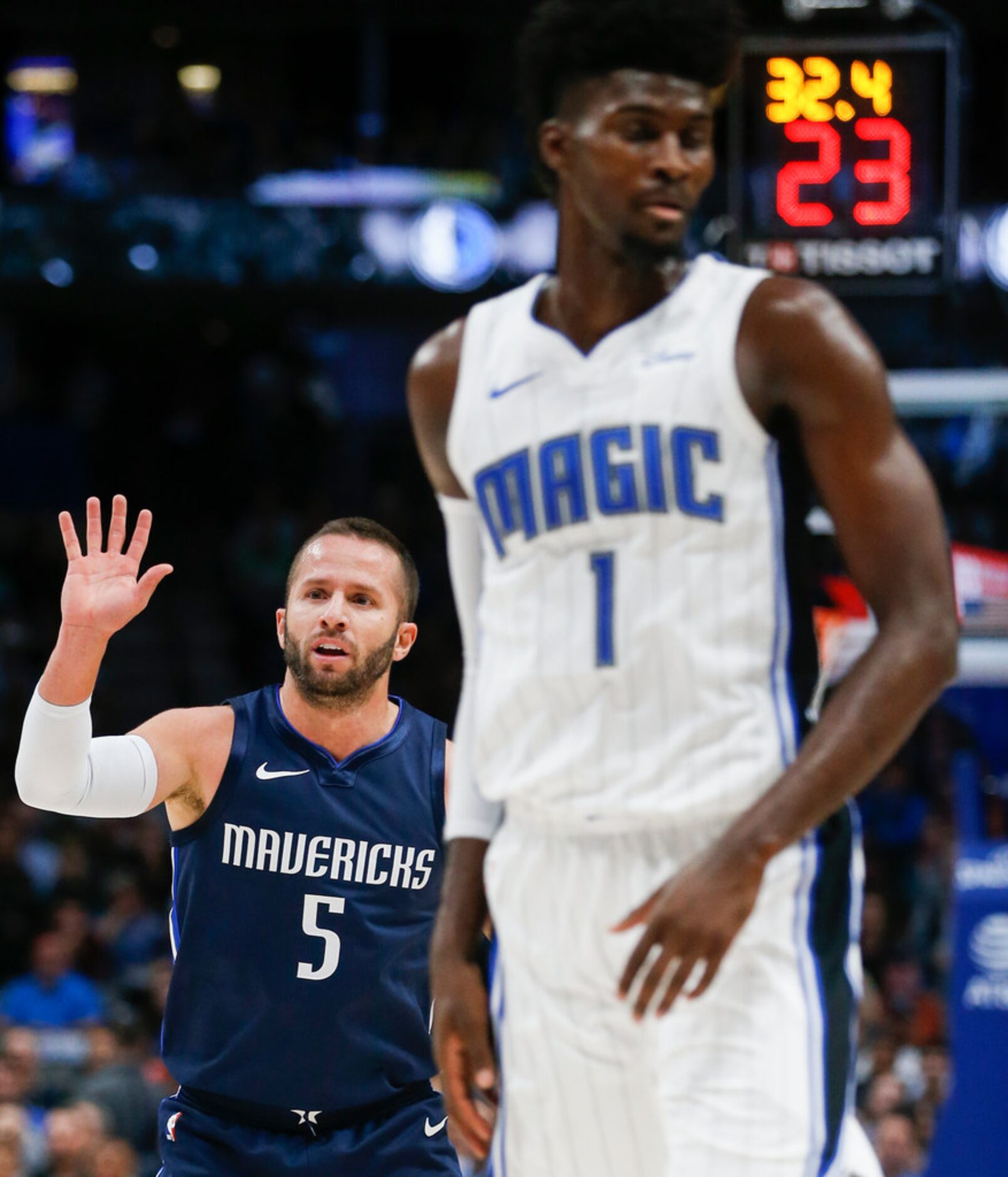 Dallas Mavericks guard J.J. Barea (5) celebrates after a play during an NBA game between the...