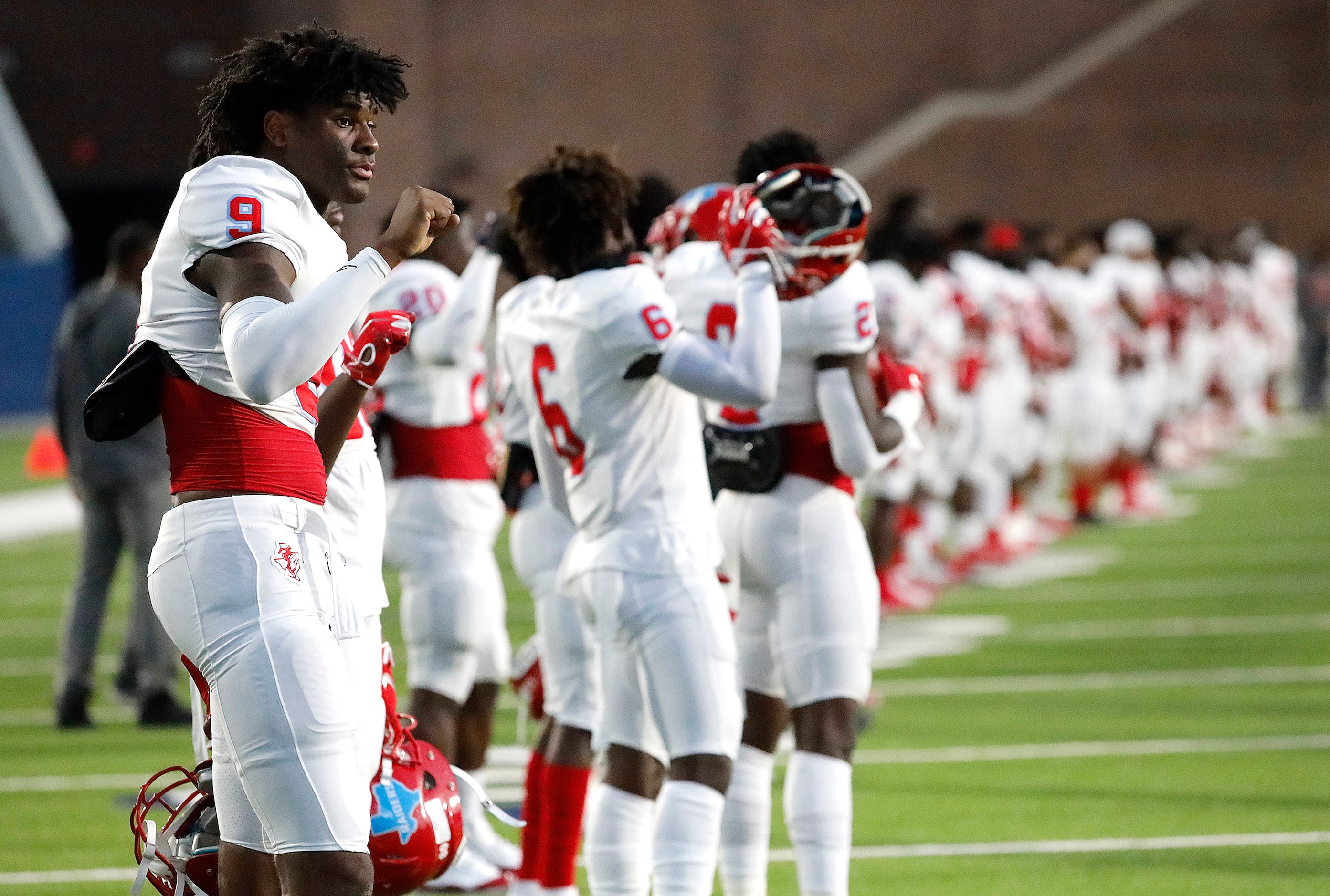 Skyline High School quarterback Darryl Richardson (9) during the national anthem as McKinney...