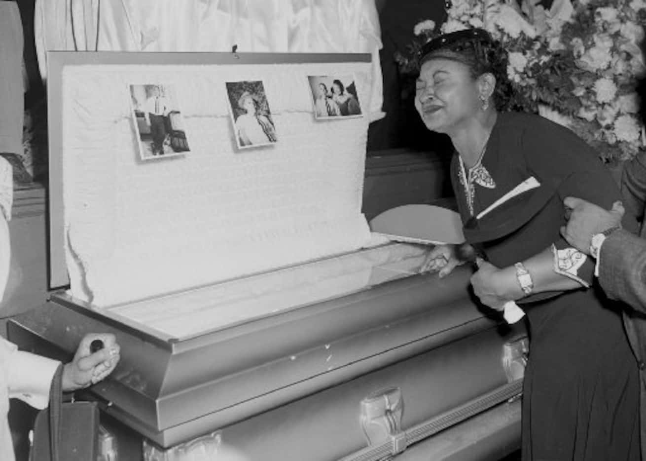 In this 1955 file photo, Mamie Mobley, mother of Emmett Till, pauses at her son's casket at...