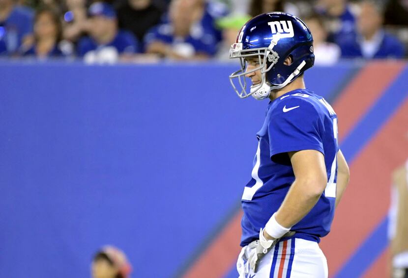 New York Giants quarterback Eli Manning reacts during the fourth quarter of an NFL football...