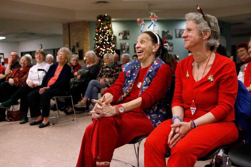 Susan Betz (left) and daughter Diana Betz laughed at a joke by Richardson Community Band...