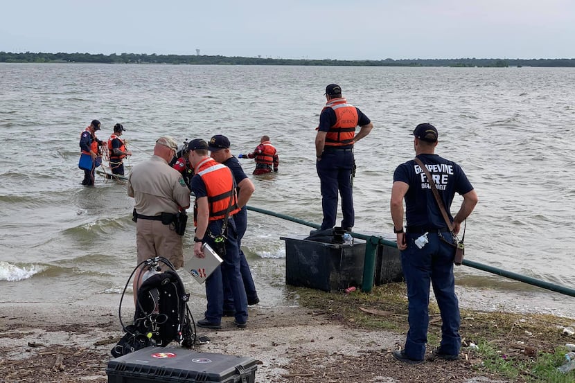 Grapevine fire crews search for a missing man in Grapevine Lake Sunday, May 27, 2019. The...