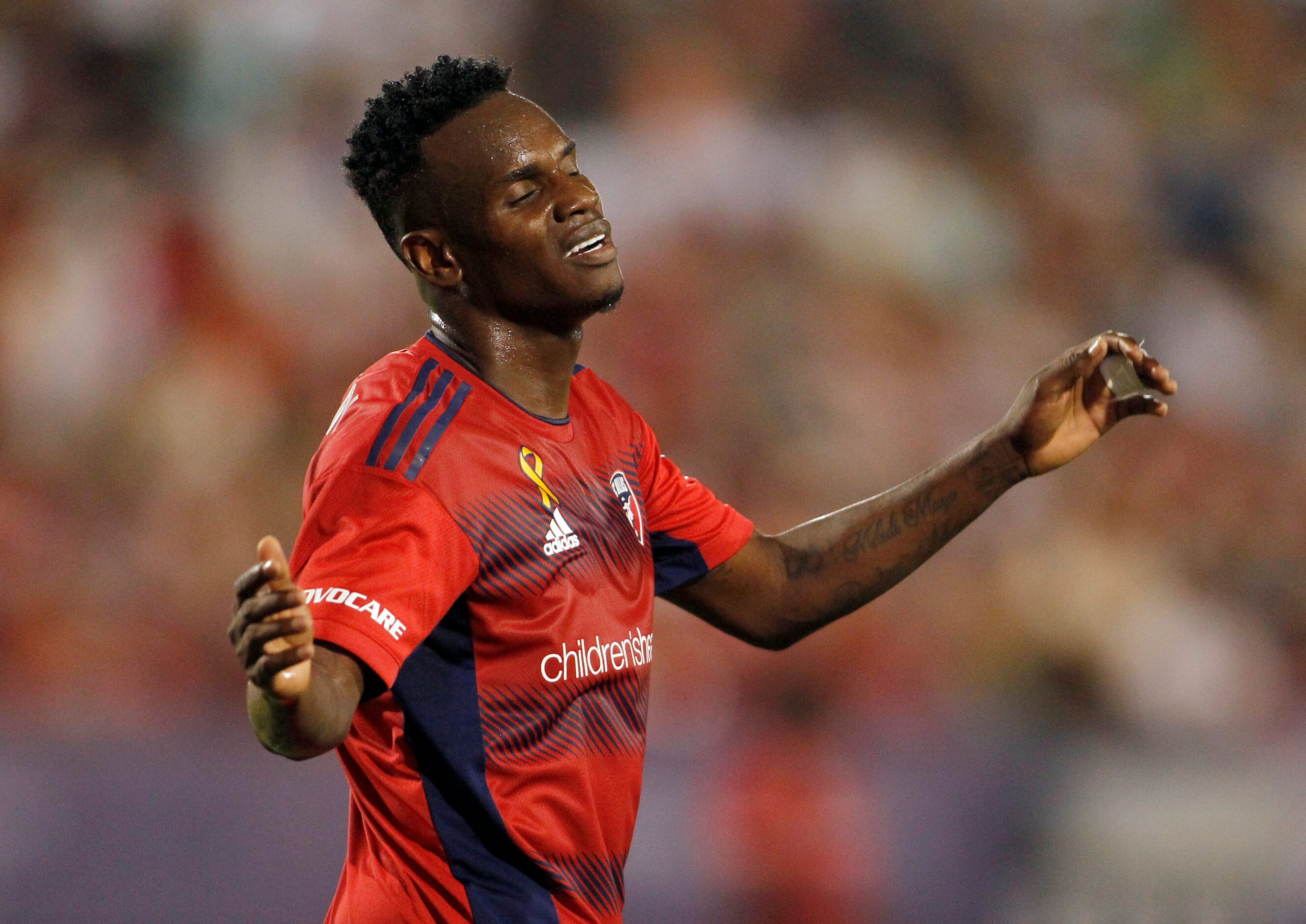 FC Dallas attacker Jader Obrian (8) reacts after missing a shot on goal during the first...