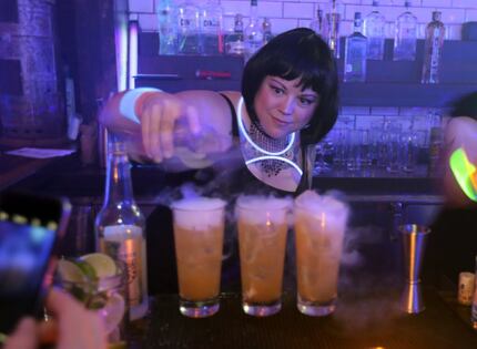 Bartender Jen Keyser pours Dark & Foggy drinks at Henry's Majestic in December.