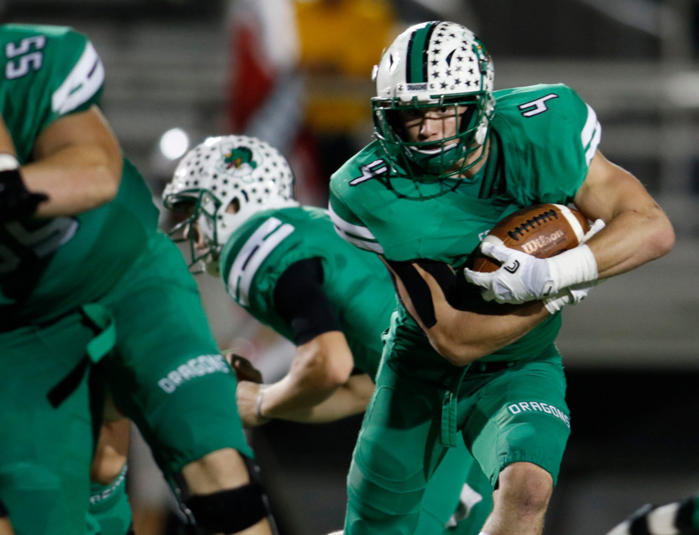 Southlake Carroll running back T.J. McDaniel (4) follows his blocks during a second quarter...