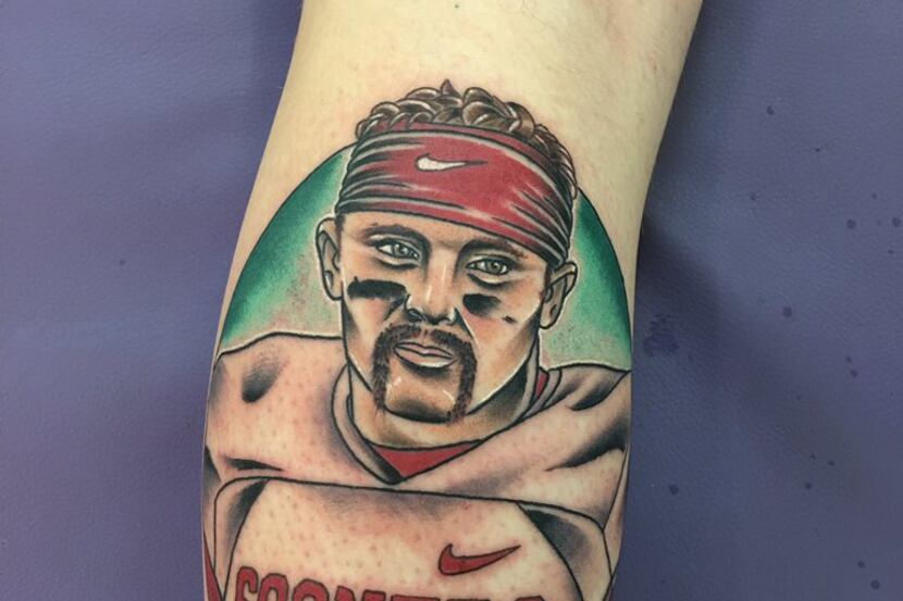 OU fan Kenneth Holzhammer displays his new tattoo of QB Baker Mayfield, fulfilling a Twitter...