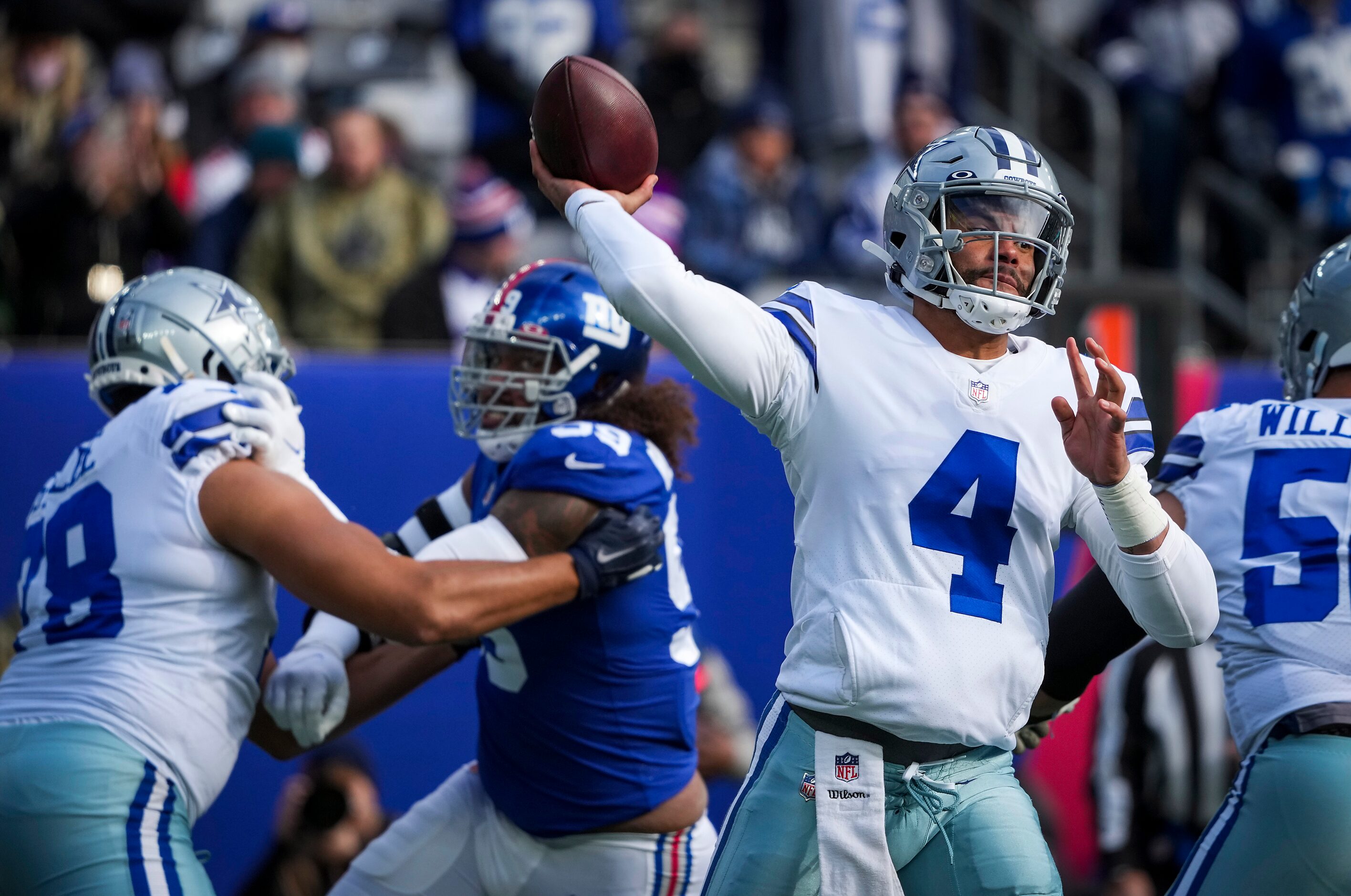 Dallas Cowboys quarterback Dak Prescott (4) throws a pass during the first half of an NFL...