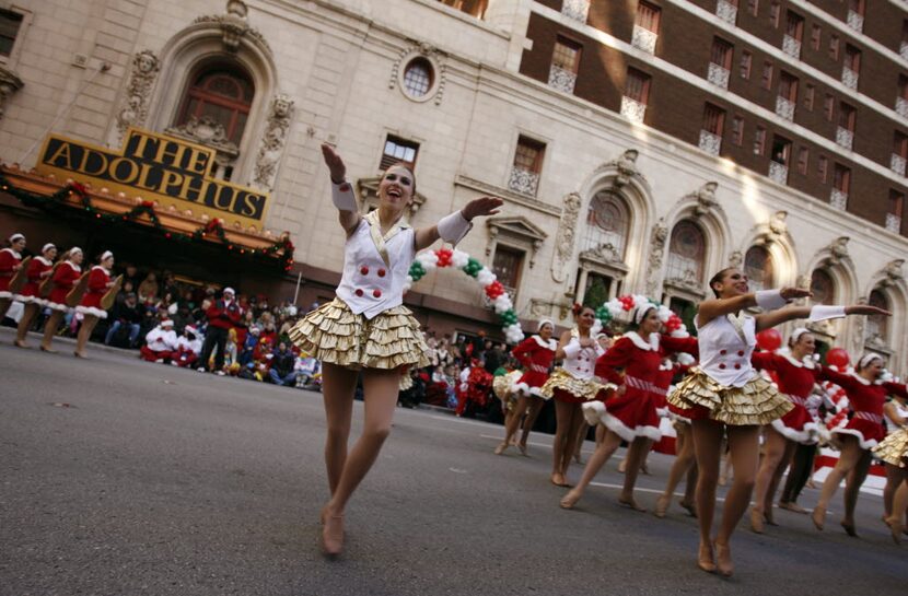 In this 2009 file photo, a group dances at the beginning of the 22nd Capital One Bank...