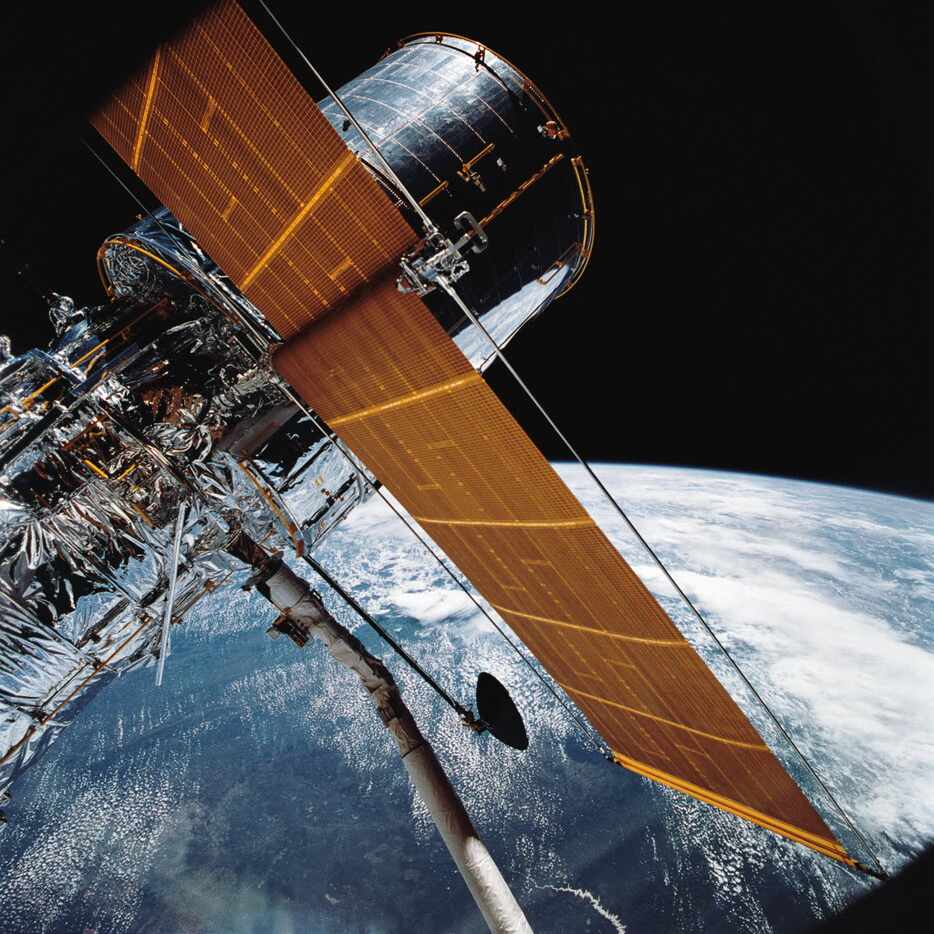 In this April 25, 1990 photograph provided by NASA, most of the giant Hubble Space Telescope...